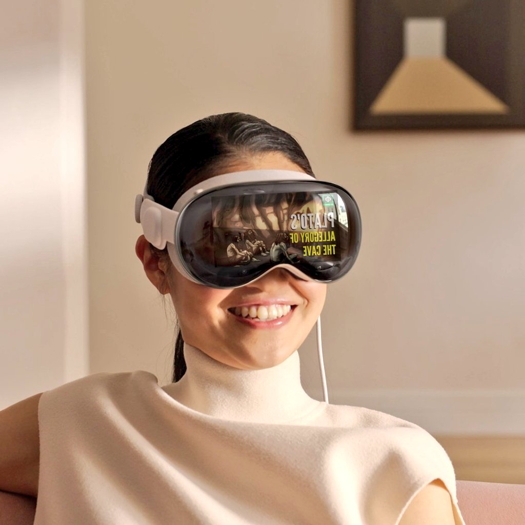 A smiling woman wearing a white VR headset, with the display showing "Plato's Allegory of the Cave" on the screen, seated comfortably in a home setting.
